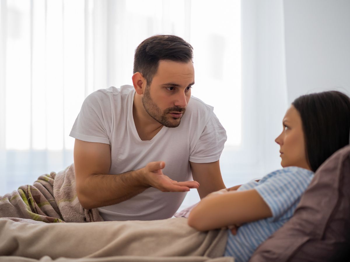 couple arguing in bed